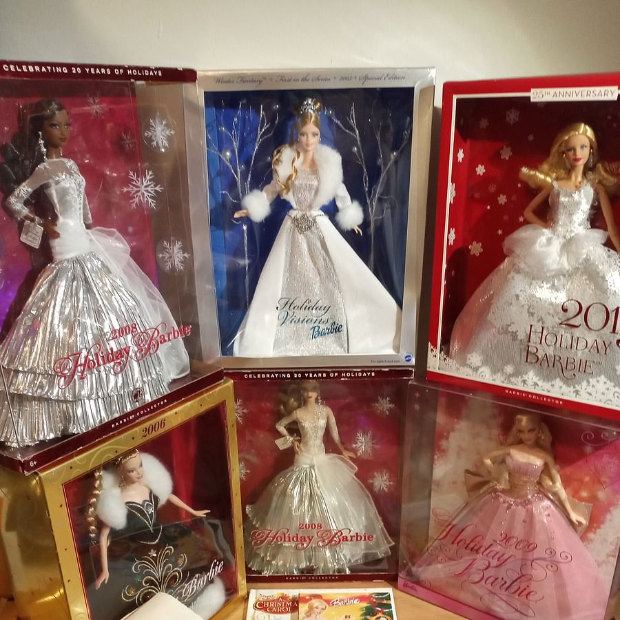 Collection of Holiday Barbie Dolls from various decades