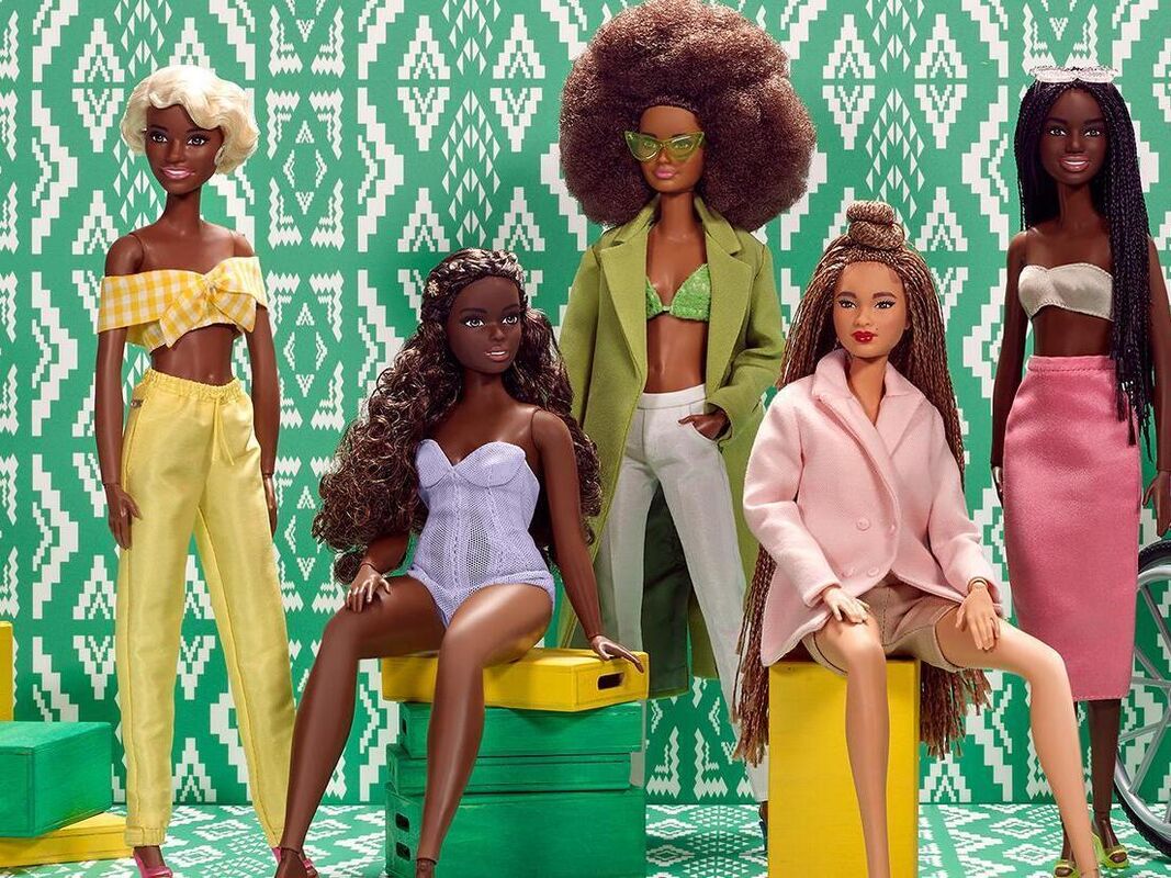 Diverse collection of Barbie dolls showcasing different body types, skin tones, hair types, and abilities